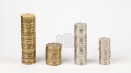 Pillars made of coins. Money, coins of different denominations on the table. The concept of a loan and a deposit in a bank