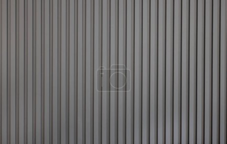 Grey wall panel. Seamless background texture of grey painted wood paneling, metal siding, ribbed background textures