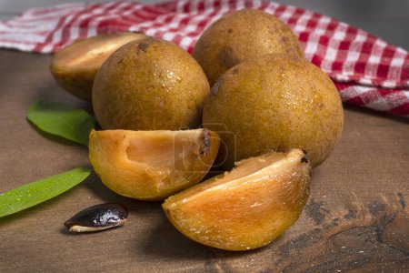 Sapodilla fruit (Manilkara zapota) and other names such as sapota, chikoo, chico, naseberry, or nispero. Sapodilla is tropical fruit evergreen tree and sweet taste fruit.