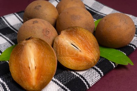 Sapodilla fruit (Manilkara zapota) and other names such as sapota, chikoo, chico, naseberry, or nispero. Sapodilla is tropical fruit evergreen tree and sweet taste fruit.
