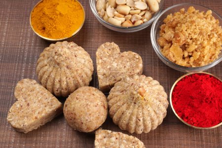 Photo for Healthy sweet peanuts and Jaggery Ladoo with  Turmeric powder. Delicious indian sweets served on  background - Royalty Free Image