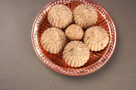 Photo for Healthy sweet groundnut or peanut and Jaggery Ladoo or balls. Delicious indian sweets served on  background - Royalty Free Image