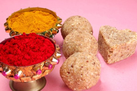 Photo for Healthy sweet groundnut or peanut and Jaggery Ladoo with  Turmeric powder. Delicious indian sweets served on  background - Royalty Free Image