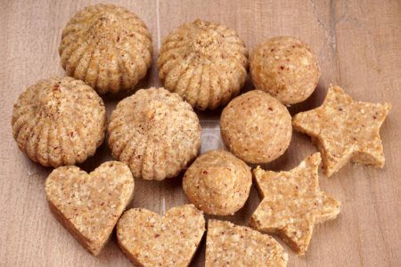 Photo for Healthy sweet groundnut or peanut and Jaggery Ladoo. Delicious indian sweets served on  background - Royalty Free Image