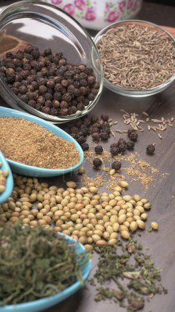 Foto de Indian Spices and herbs on wooden background. Food and cuisine ingredients - Imagen libre de derechos