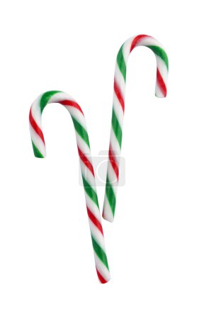 Téléchargez les photos : Deux cannes de bonbons de Noël de couleur blanche, rouge et verte isolées sur blanc - en image libre de droit