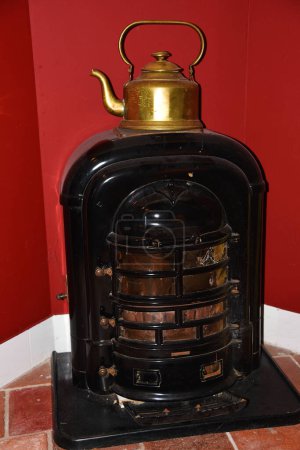 Photo for Alkmaar, Netherlands. January 2023. An old coal stove with a kettle. High quality photo - Royalty Free Image