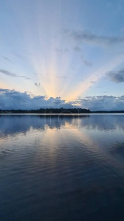 Sunbeams over a lake in sweden. High quality photo