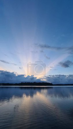 Sunbeams over a lake in sweden. High quality photo