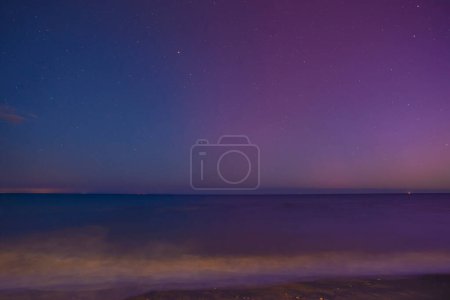 May 11, 2024, the phenomenon of the Northern Lights visible when observing the sky in Tuscany. Aurora borealis reflected in the sea. San Vincenzo, Tuscany, Italy