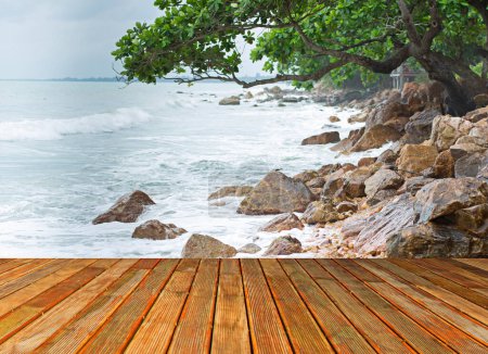 Photo for Beautiful wooden floor  sea backgroundsea has and waves crashing on the rocks. - Royalty Free Image