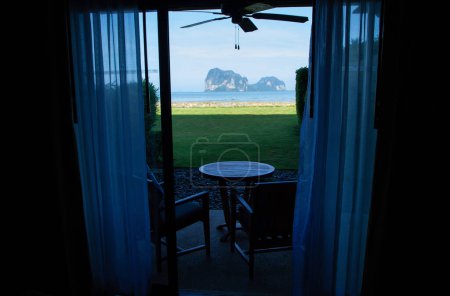 Photo for The bedroom opens to a window overlooking the sea. - Royalty Free Image