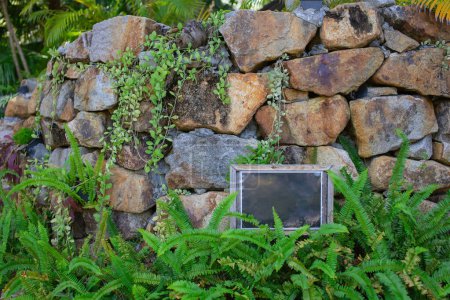 Photo for The garden is beautifully decorated with a layered stone decoration consisting of plants and signs. - Royalty Free Image