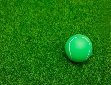 Photo for Tennis ball set on soft background green grass - Royalty Free Image