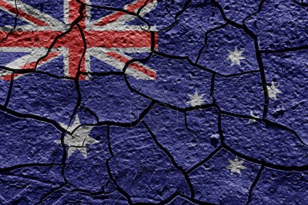 Téléchargez les photos : Australia flag on a mud texture of dry crack on the ground - en image libre de droit