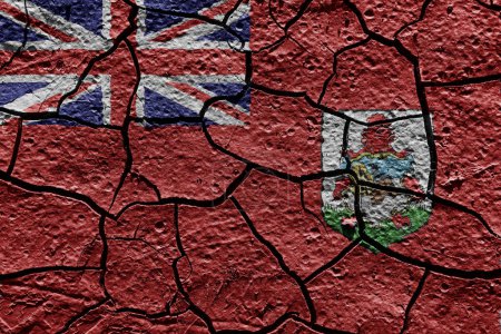 Téléchargez les photos : Bermuda flag on a mud texture of dry crack on the ground - en image libre de droit