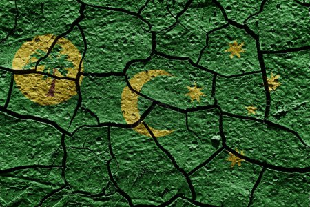 Téléchargez les photos : Cocos Keeling Islands flag on a mud texture of dry crack on the ground - en image libre de droit