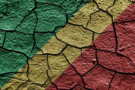 Téléchargez les photos : Congo Republic flag on a mud texture of dry crack on the ground - en image libre de droit