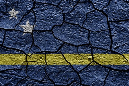 Téléchargez les photos : Curacao flag on a mud texture of dry crack on the ground - en image libre de droit