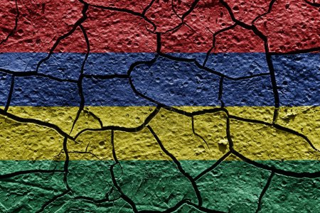 Téléchargez les photos : Mauritius flag on a mud texture of dry crack on the ground - en image libre de droit