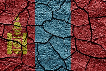 Foto de Mongolia flag on a mud texture of dry crack on the ground - Imagen libre de derechos