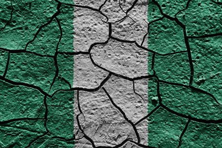 Photo for Nigeria flag on a mud texture of dry crack on the ground - Royalty Free Image