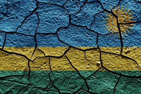 Téléchargez les photos : Rwanda flag on a mud texture of dry crack on the ground - en image libre de droit