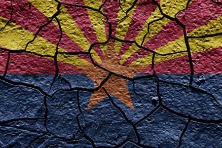 Téléchargez les photos : Arizona state flag of United States on a mud texture of dry crack on the ground - en image libre de droit