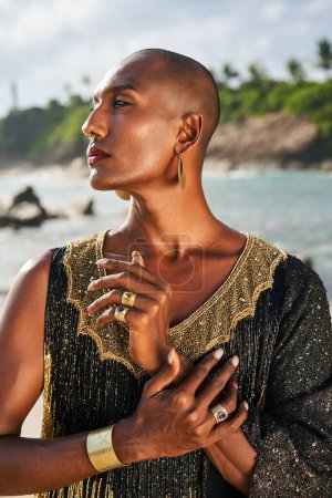 Photo for Gender fluid biracial gay hands with jewelry rings, bracelets. Bipoc trans model poses with manicure in closeup. Androgynous drag person touches hands tenderly. Pride. Transgender shows his identity. - Royalty Free Image