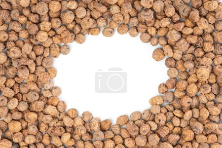 Photo for Studio shot of top view of a bunch of tiger nuts on a white background with copy space in the middle - Royalty Free Image