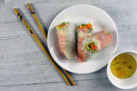 spring roll with chop stick and sauce