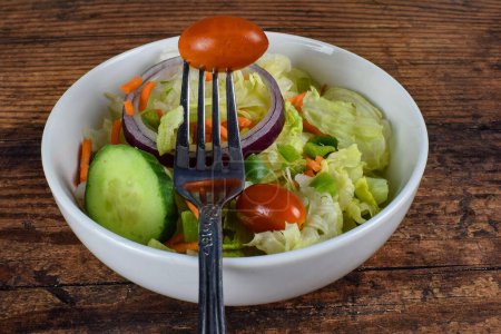 Photo for Toss salad with a fork - Royalty Free Image