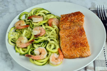 Photo for Baked season salmon served with zucchini noodle  and shrimp., - Royalty Free Image
