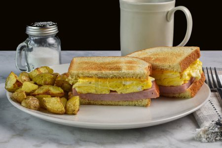 Photo for Scramble egg sandwich  with  ham steak top with melted cheese. - Royalty Free Image