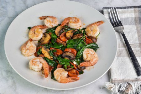 sauteed shrimp with  sauteed spinach mushrooms and tomatoes,