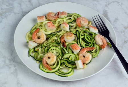 Photo for Zucchini noodles  served with crab meat and sauteed shrimp - Royalty Free Image