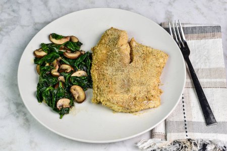 sauteed spinach and mushrooms served with  baked haddock 