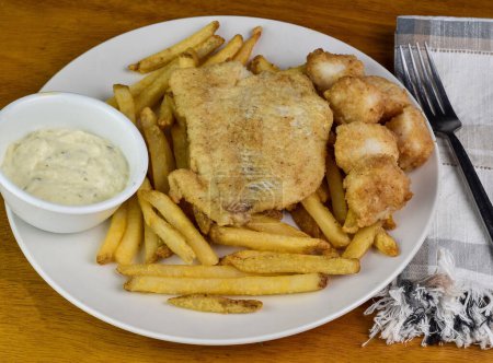 baked haddock served with baked scallops  and french fries