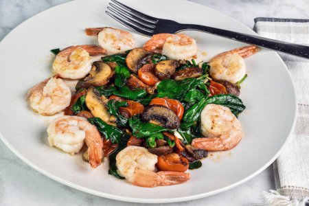 sauteed shrimp with  sauteed spinach mushrooms and tomatoes, 