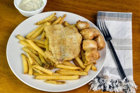 baked haddock served with baked scallops  and french fries