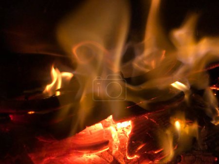 Photo for Wood burning in a solid fuel wood burning stove inside a home in winter - Royalty Free Image