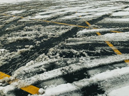Photo for Confusion in parking lots after snow covers lines where cars go everywhere - Royalty Free Image