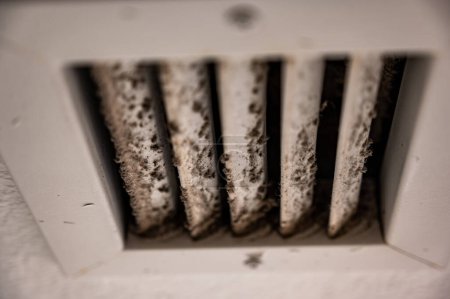 White vent showing dirt and grime from daily use. Concept of cleaning and air pollution