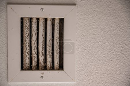 Photo for White vent showing dirt and grime from daily use. Concept of cleaning and air pollution - Royalty Free Image