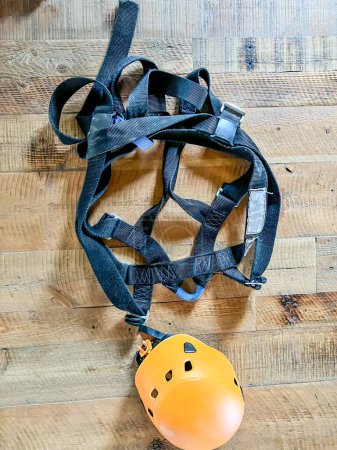 Foto de Row of helmets ready for use at a high ropes and climbing course. . High quality photo - Imagen libre de derechos