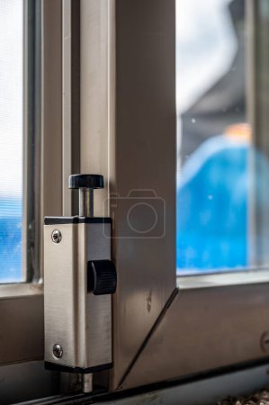 Photo for Typical installation of a sliding door lock in the open position - Royalty Free Image