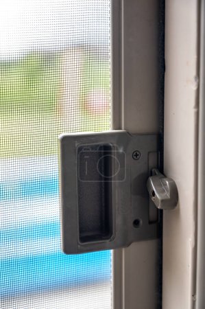 Photo for Typical installation of a sliding screen door hardware - Royalty Free Image