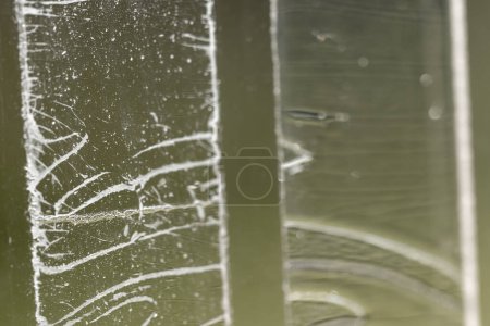 Photo for Strip of tape adhesive on a glass surface after being pulled. . High quality photo - Royalty Free Image
