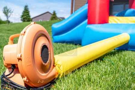 Subject focus on bouncy house blower fan. High quality photo