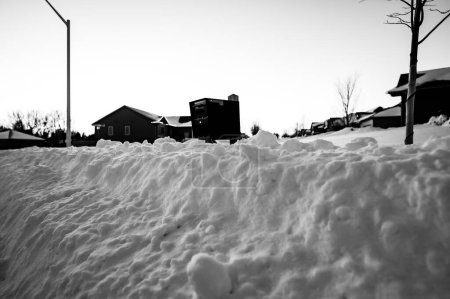 Photo for Residential mailbox blocked by a snow pile left by a plow after clearing a street. High quality photo - Royalty Free Image